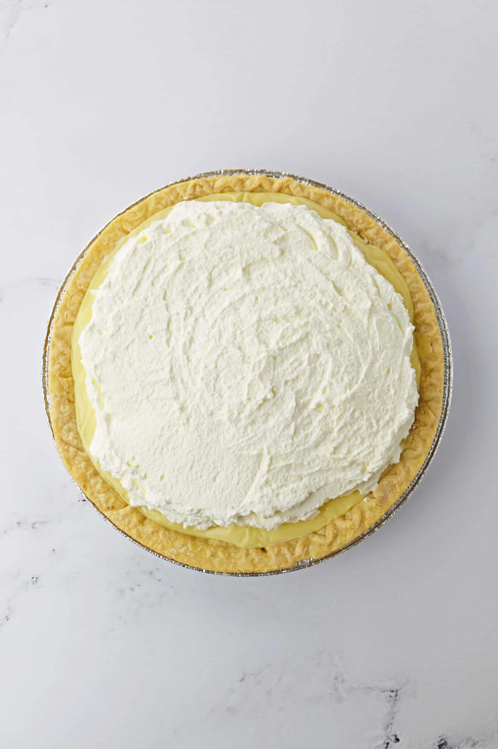 top the custard with whipped cream