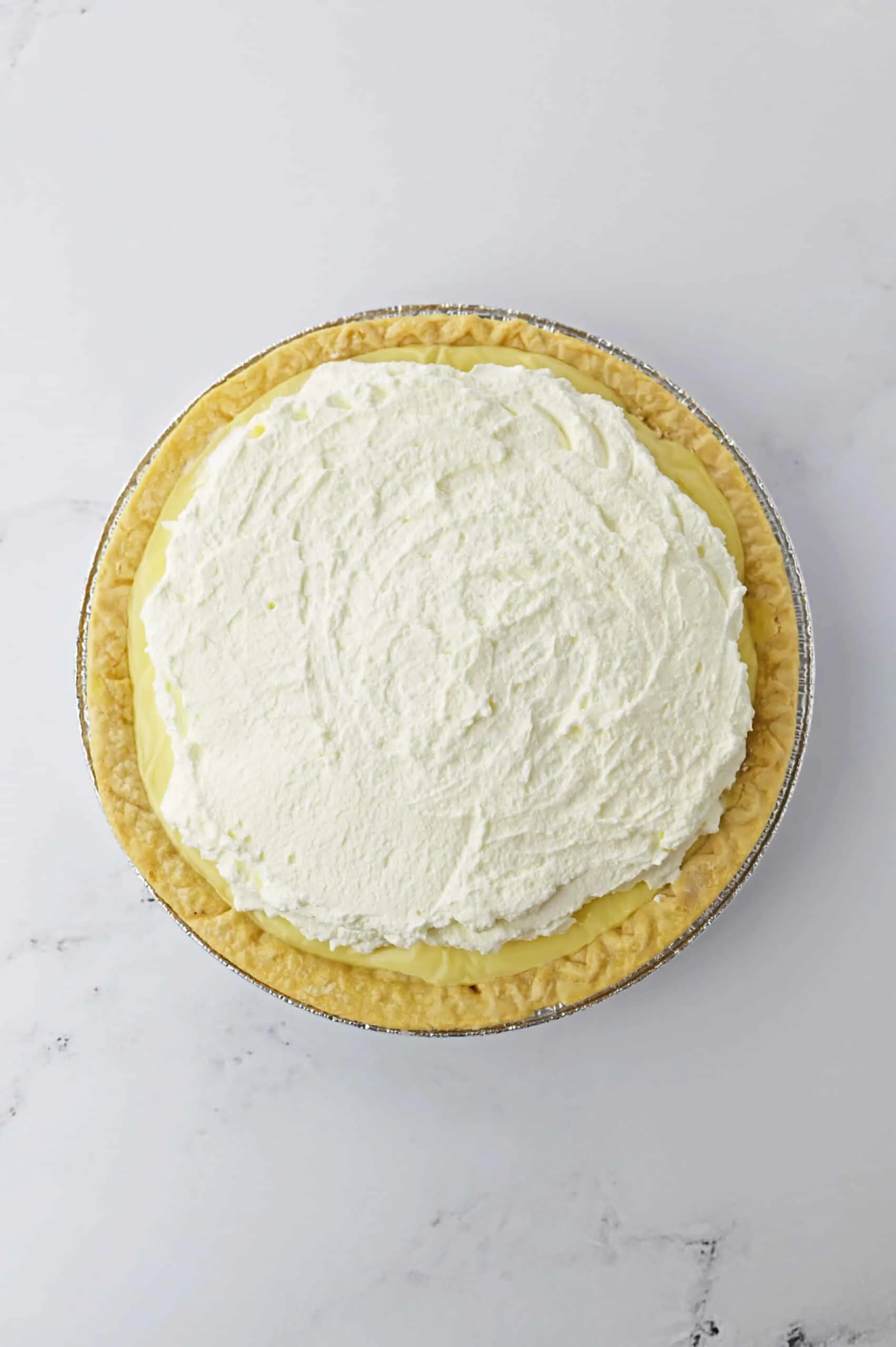 top the custard with whipped cream