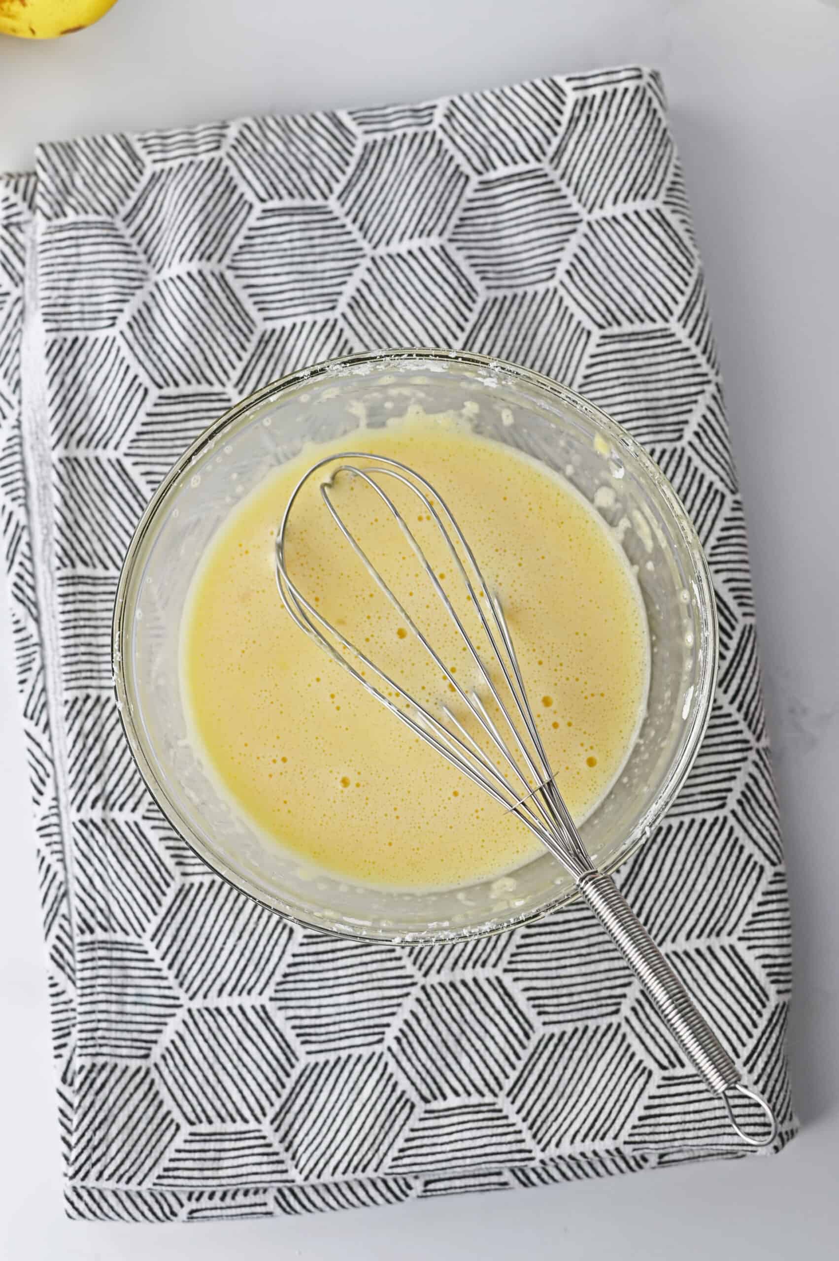 Remove ½ cup of the hot milk mixture, and whisk into the eggs and cornstarch to temper the eggs for the custard for banana cream pie