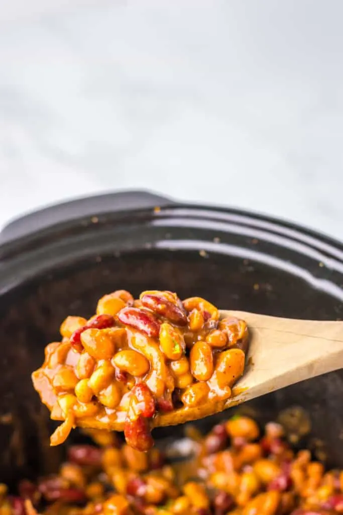 Slow Cooker Dr. Pepper Baked Beans wooden spoon