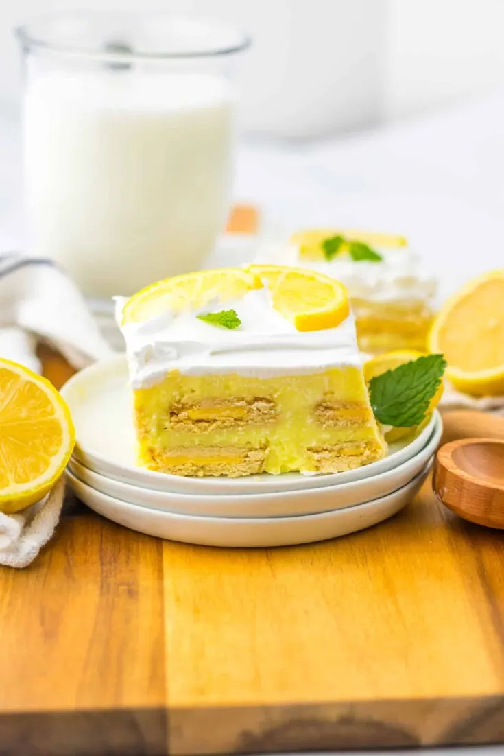 Lemon Icebox Cake served with lemon with glass of milk