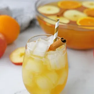 apple cider punch with bowl and cocktail in front