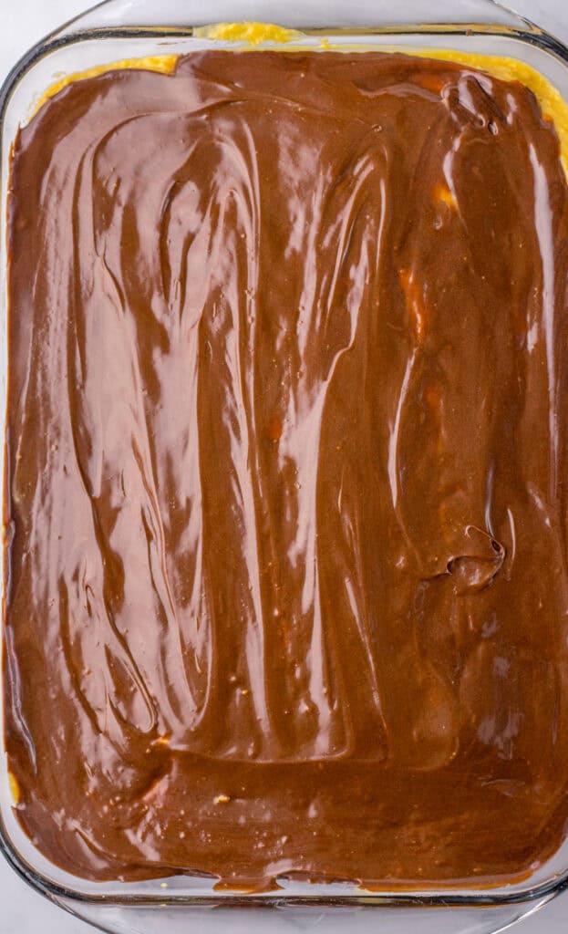 add chocolate frosting to Peanut Butter Poke Cake