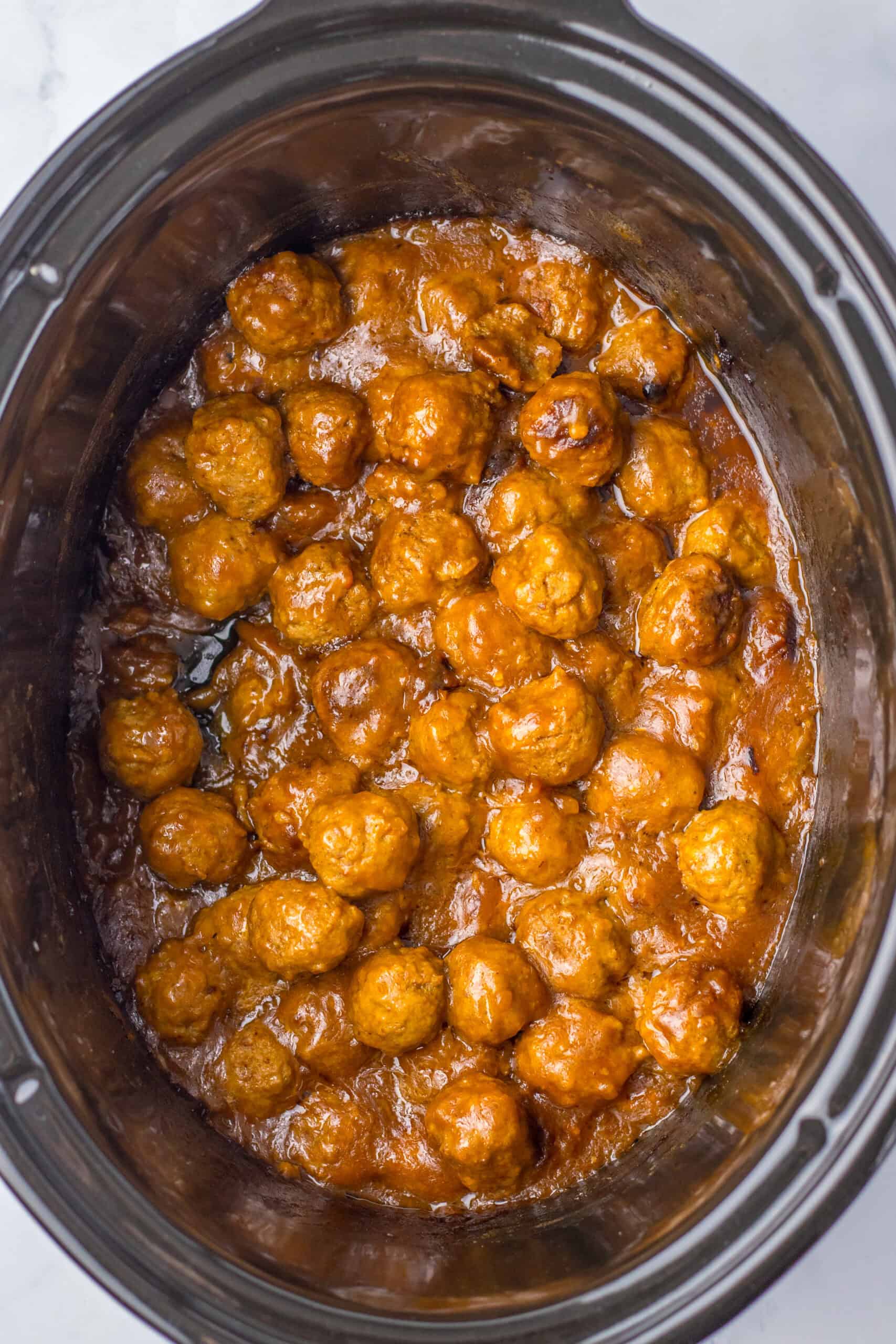 Delicious slow cooker Salisbury steak meatballs in savory gravy. Perfect comfort food for family din.