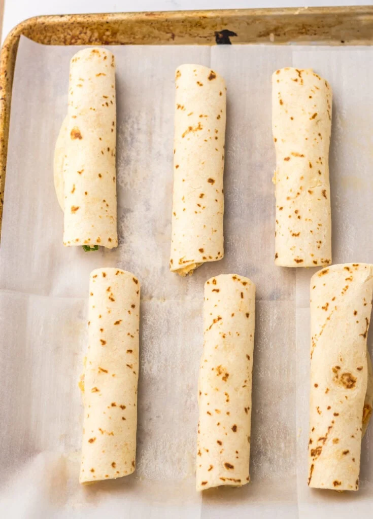 place stuffed tortillas on baking sheet