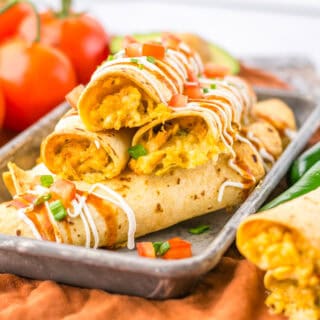 horizontal shot Baked Cheesy Chicken Taquitos