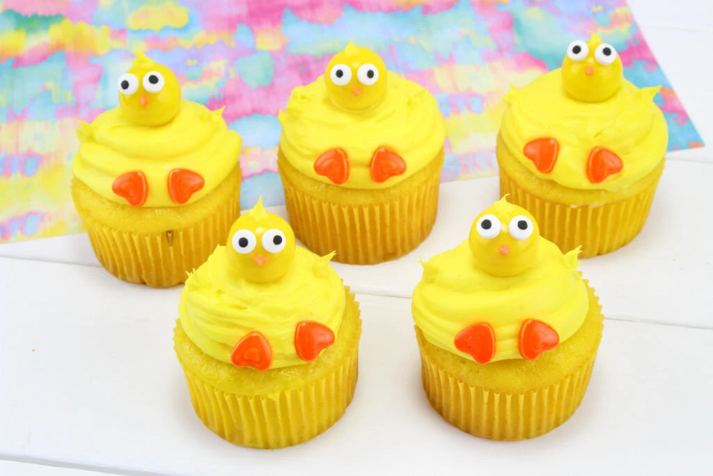 Five cute chick cupcakes after decorating