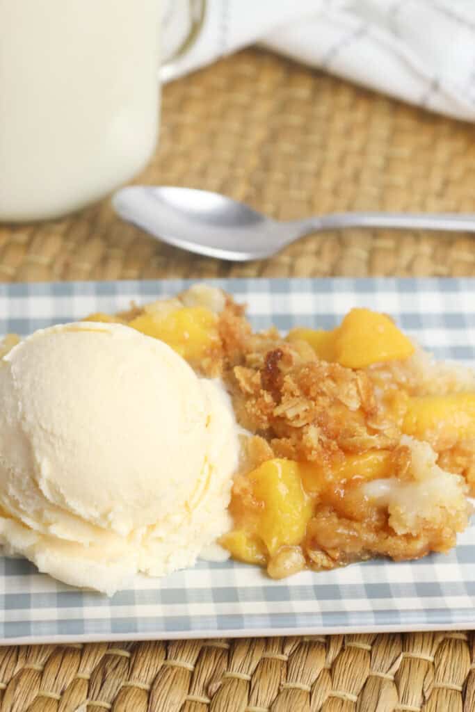 Peach crisp cake with vanilla ice cream.