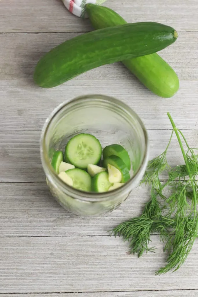 Kirby Cucumbers and garlic in jar