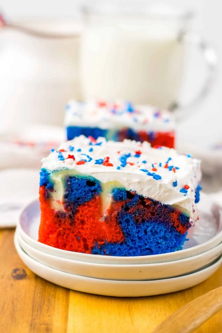 A slice of red, white and blue cake on a plate.