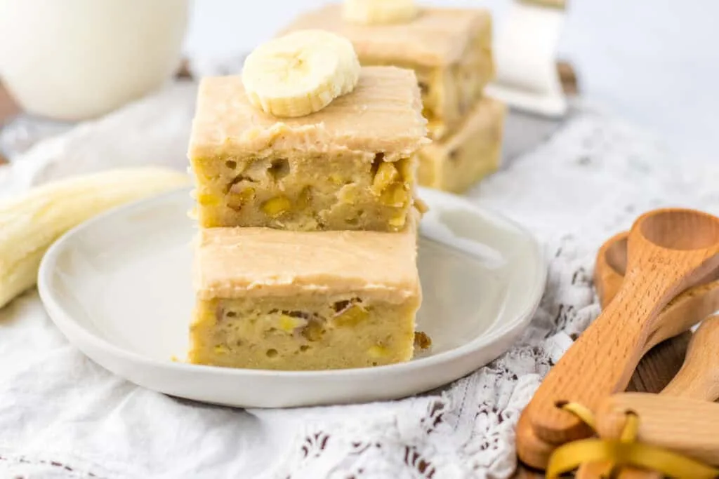 two banana bars stacked on white plate