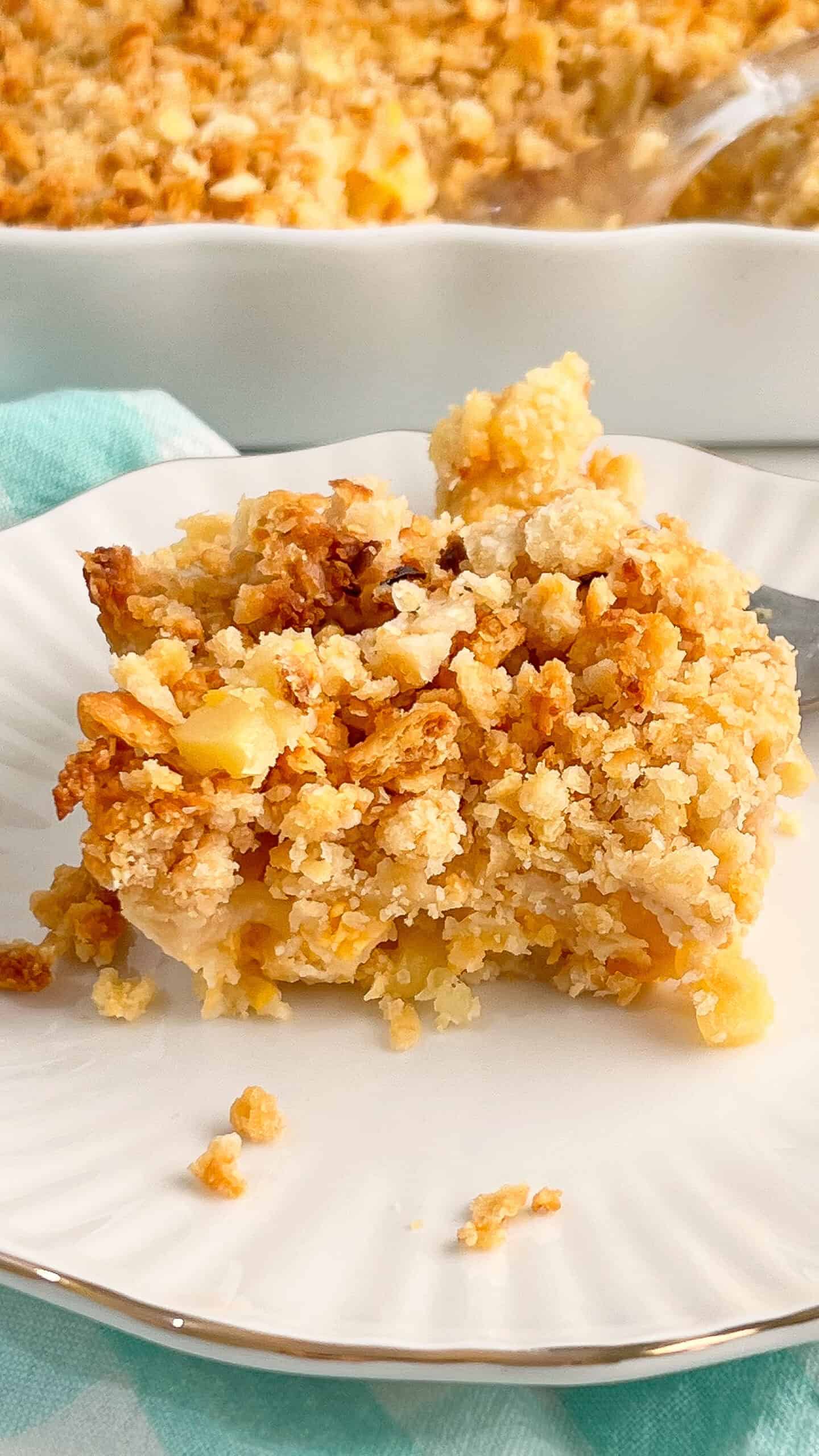 Baked Pineapple Casserole is the Southern comfort food you didn’t know you needed! With juicy pineapple tidbits, sharp cheddar cheese, and a crunchy buttery cracker topping, this dish is the perfect balance of sweet, savory, creamy, and crisp. It’s easy to make and pairs beautifully with baked ham, roast chicken, or a holiday spread. via @Mooreorlesscook