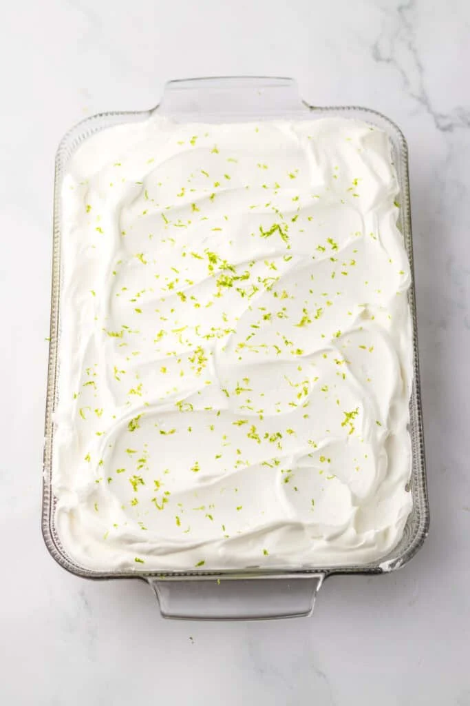 whole poke cake in baking dish before being sliced