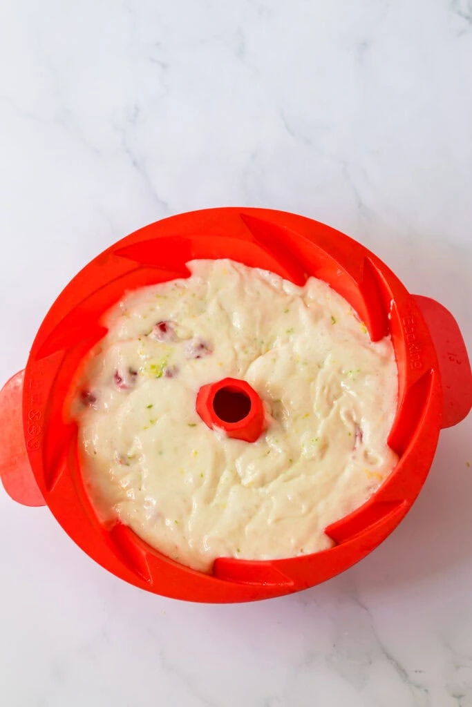 Cake batter poured into bundt pan ready to bake