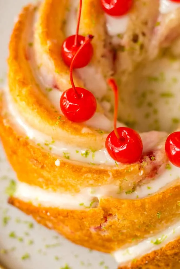 Golden cake with cherries and cream, perfect for dessert