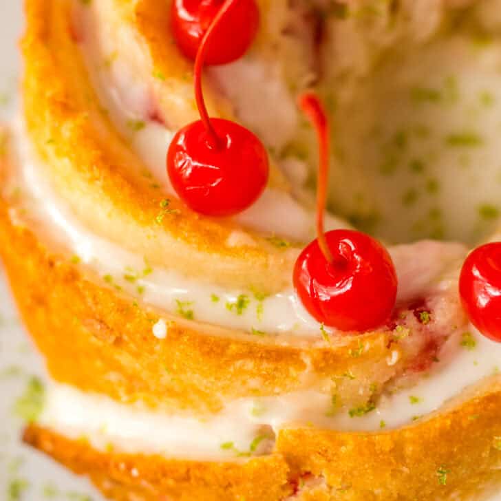 Golden cake with cherries and cream, perfect for dessert