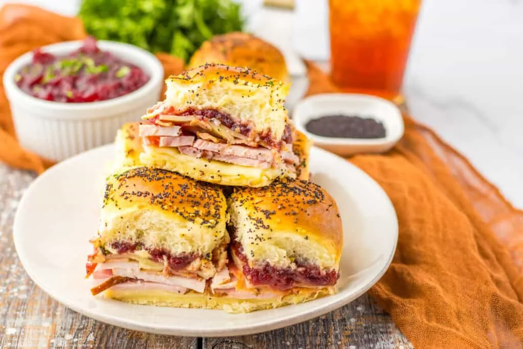 Cranberry Club Sliders Savory with ham and cheese on white plate, easy brunch recipe, Moore or Less Cooking.
