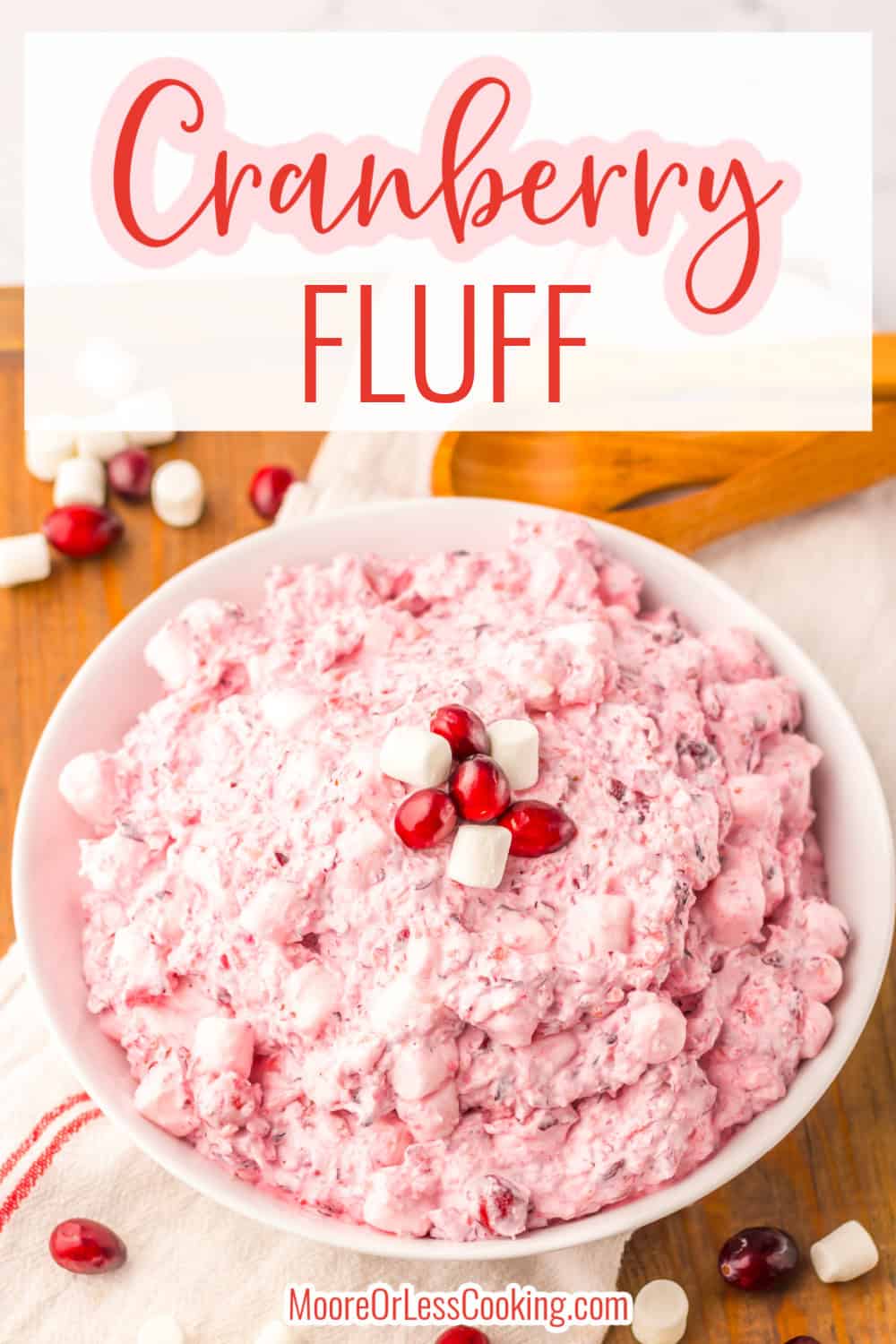 This Cranberry Fluff is perfect for all of the holiday celebrations! Full of tart cranberries, sweet pineapple, fluffy marshmallows and a whipped cream base makes this fluff is so delicious! It's an easy to make side or dessert that's perfect for the holidays. Everyone always loves this classic recipe and it looks so festive! via @Mooreorlesscook