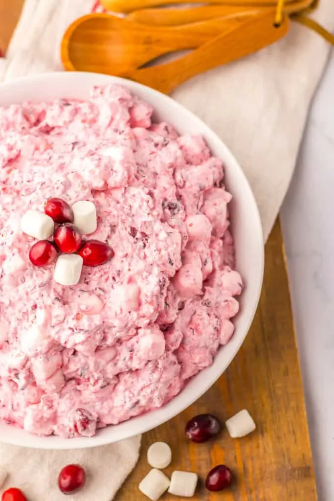 Creamy cranberry salad with mini marshmallows, perfect for holiday gatherings and dessert tables.