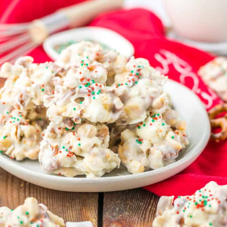 Creamy Christmas popcorn with colorful sprinkles, marshmallows, and holiday treats.