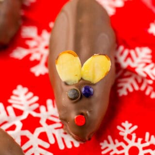 Chocolate mouse Christmas treat for kids, decorated with candy eyes, nose, and antlers, perfect for holiday celebrations.
