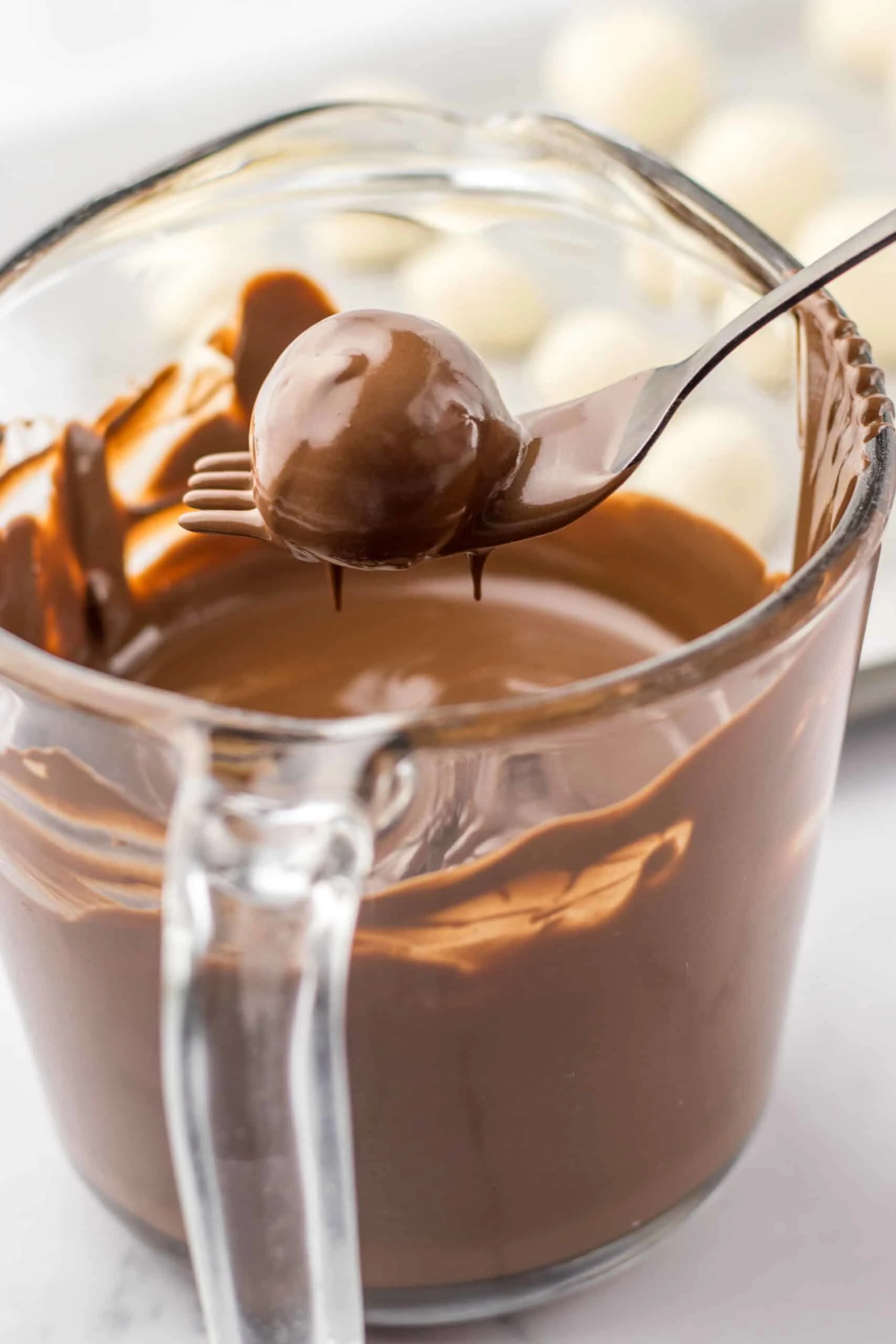 dip refrigerated truffles in chocolate