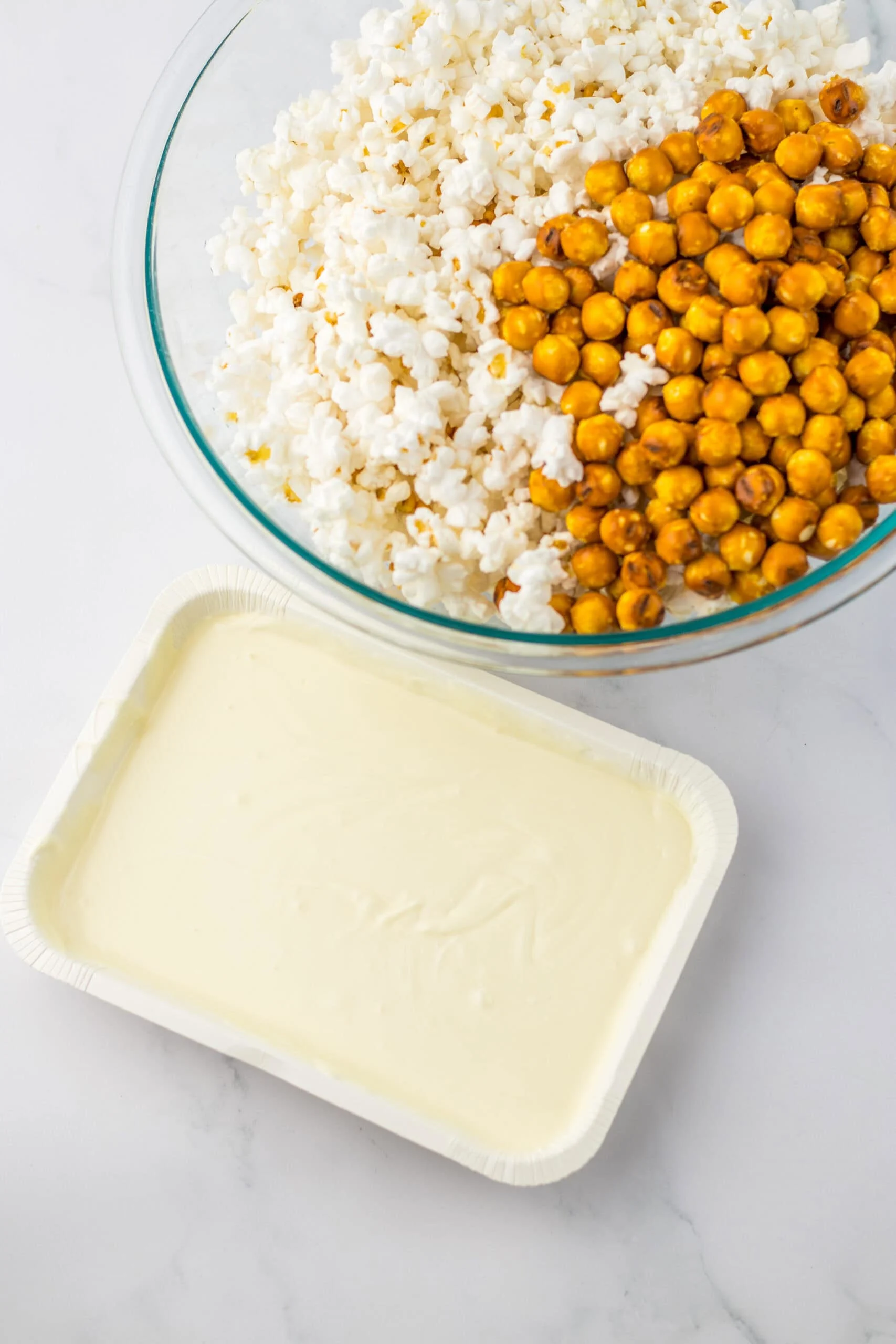 melted white chocolate popcorn in bowl