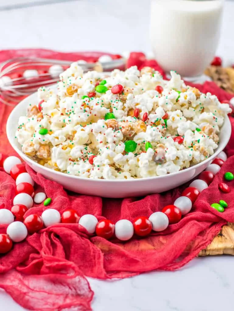 bowl filled with popcorn red beads cloth
