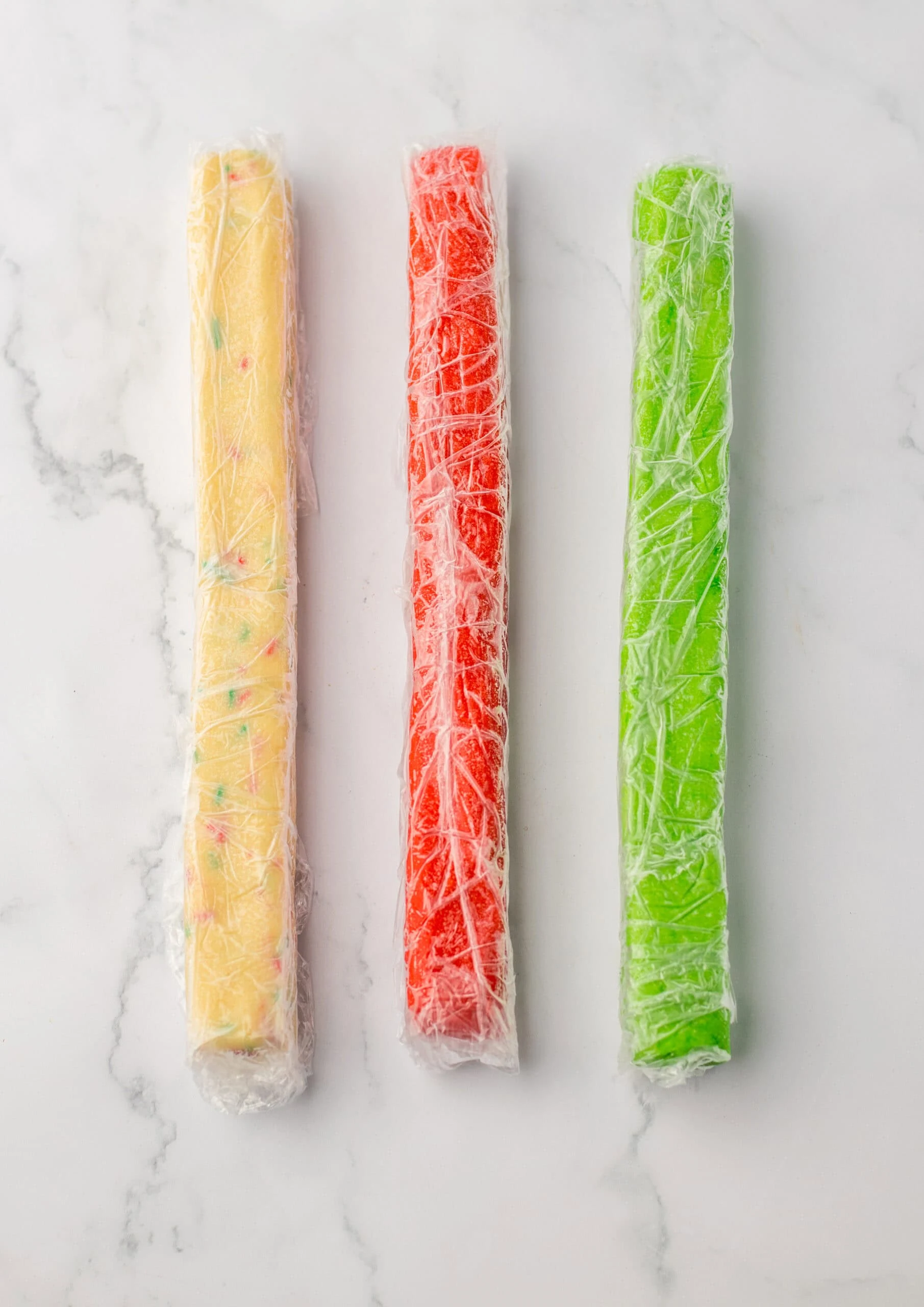 wrap dough into logs with saran wrap