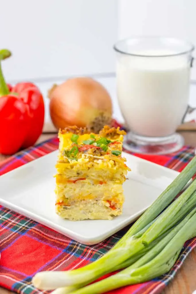 sering casserole white plate, gingham tablecloth, beads, onions, milk