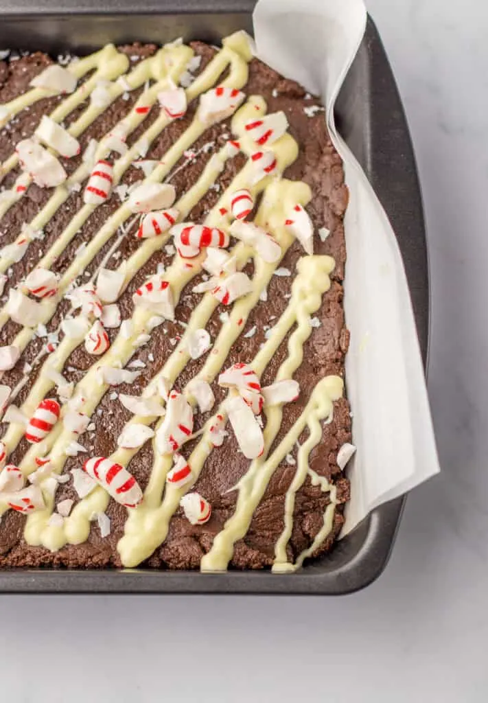 peppermint fudge in a parchment lined pan
