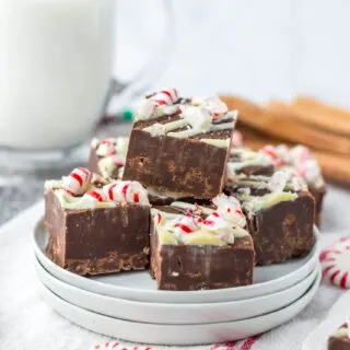 on white plates Slow Cooker Peppermint Bark Fudge cut up in chunks