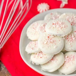 white chocolate thin mints close up red cloth whisk and peppermints