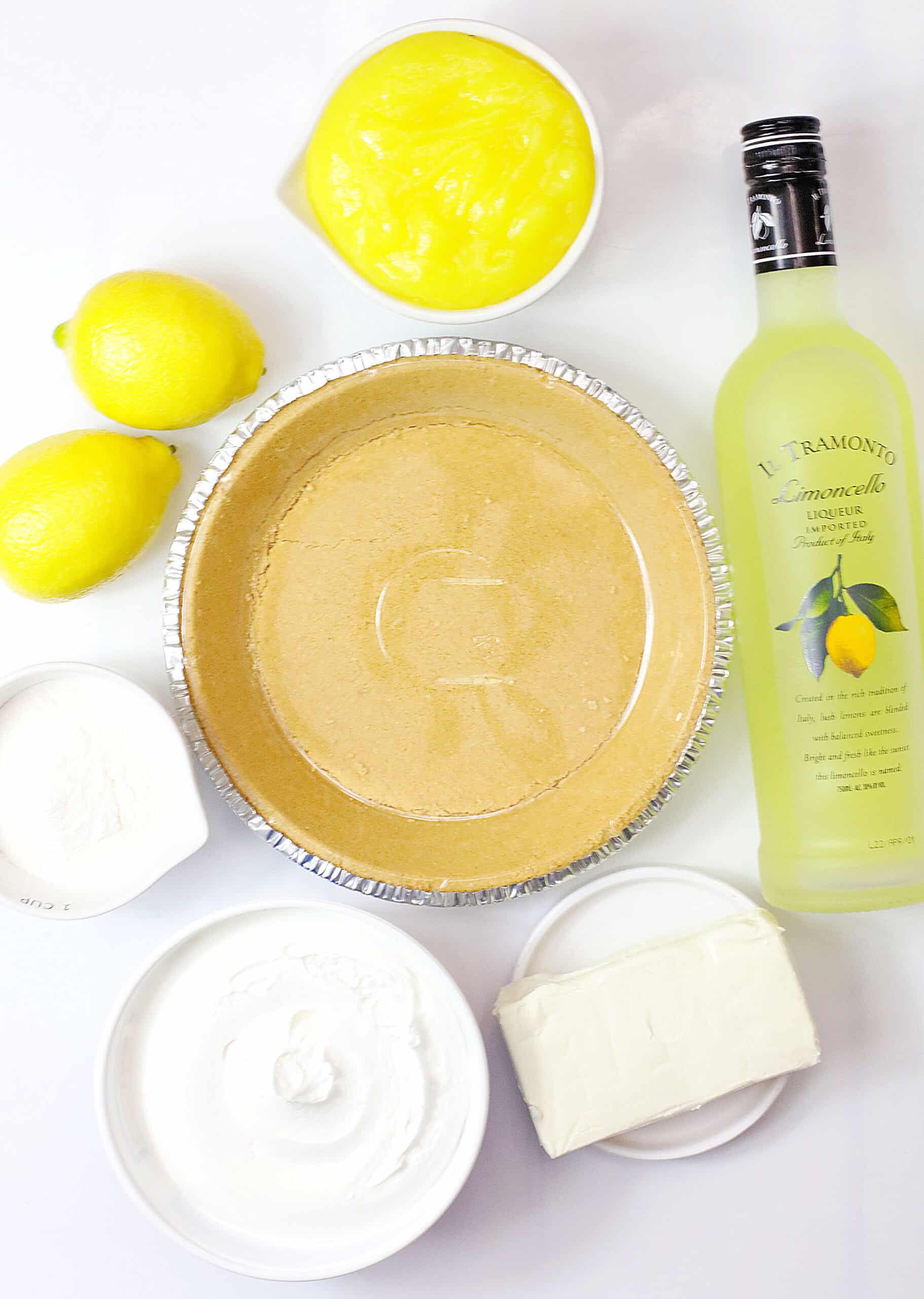 Delicious Limoncello cream cheese pie with fresh lemons and creamy filling. Perfect for summer desse.