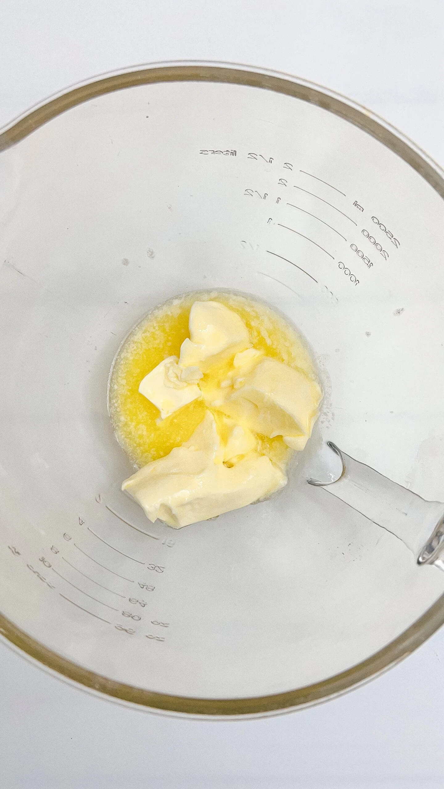 Alt text: Butter and sugar in a mixing bowl, ready for baking recipes.