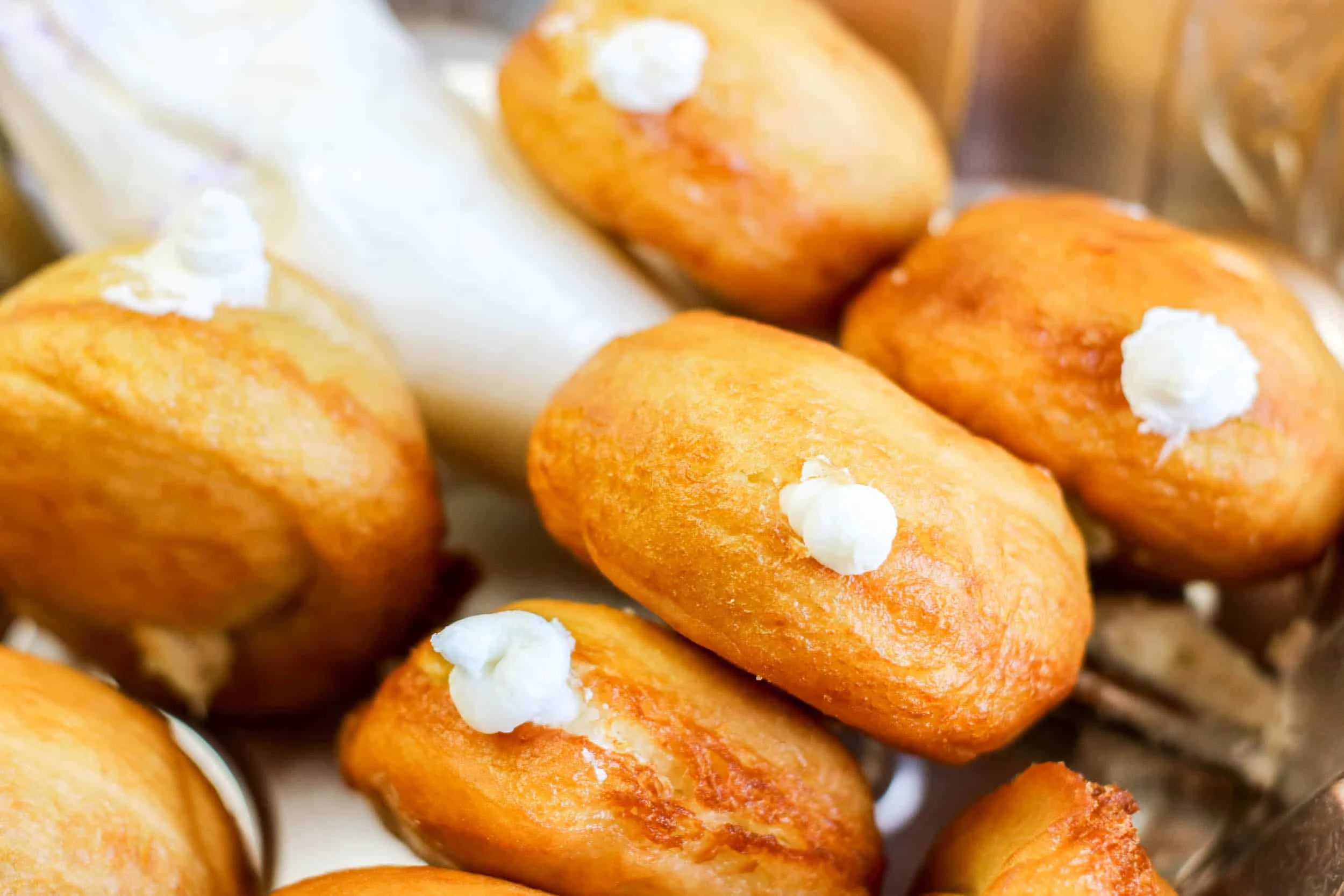 cream piped in donut