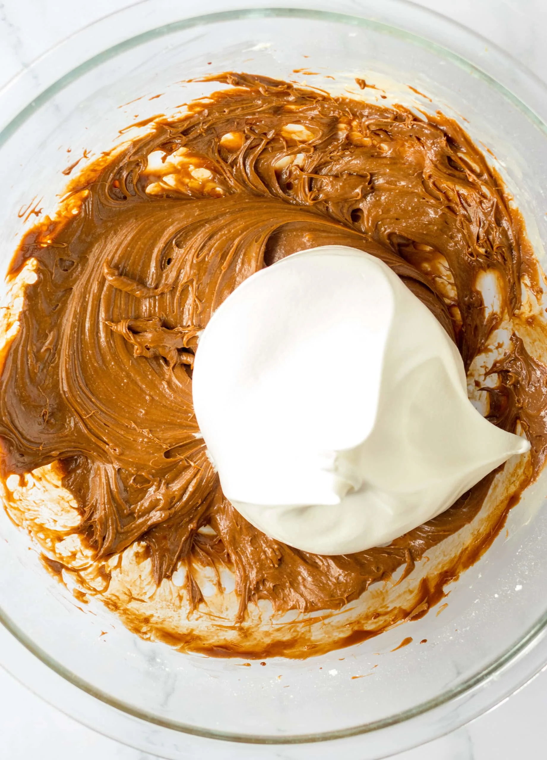 Smooth, creamy chocolate batter with whipped cream for French Silk Brownies.