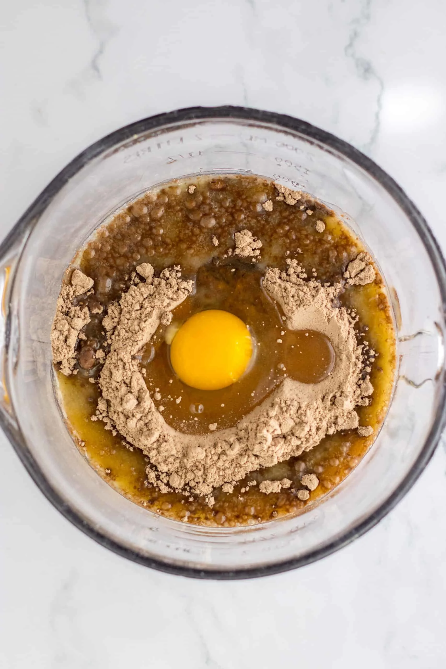 Chocolate brownie batter with egg and cocoa for French Silk Brownies.