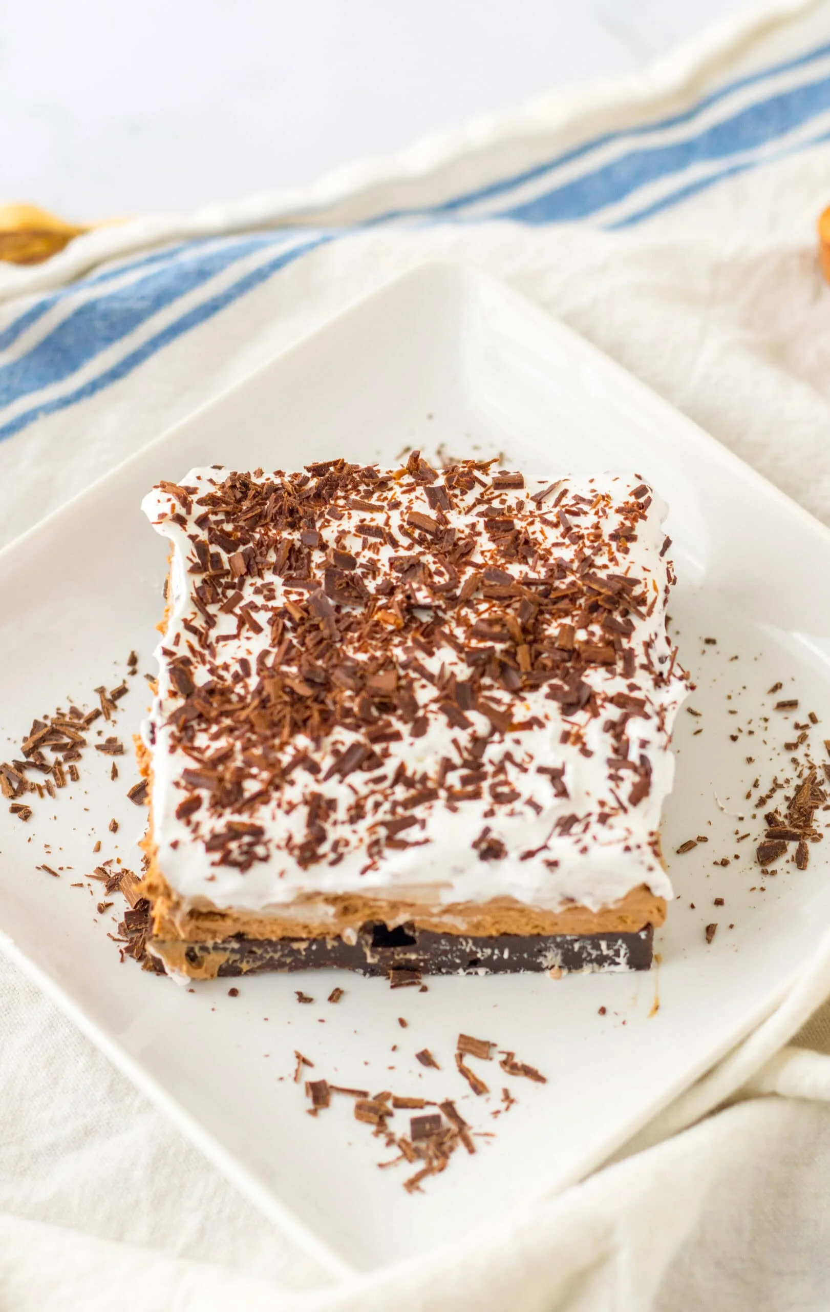 serving French Silk Brownies on white plate