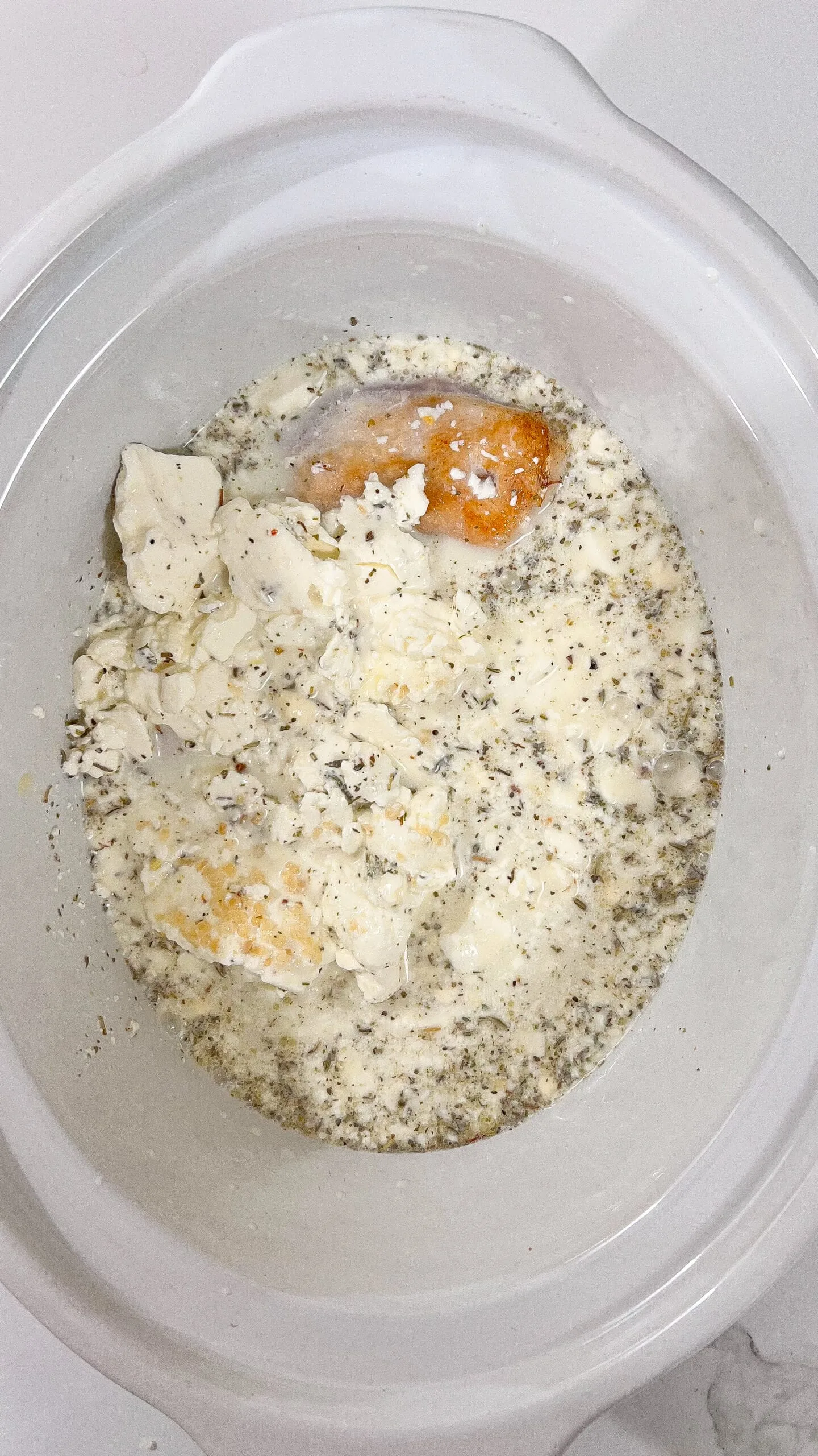 Raw ingredients for Crockpot Angel Chicken with creamy garlic sauce.