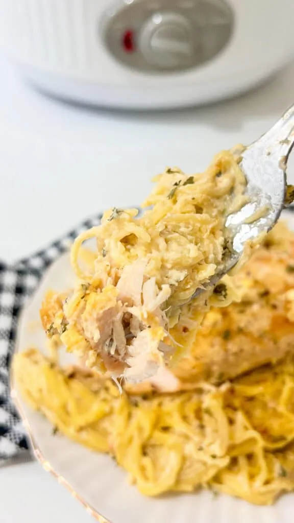 bite of chicken and pasta