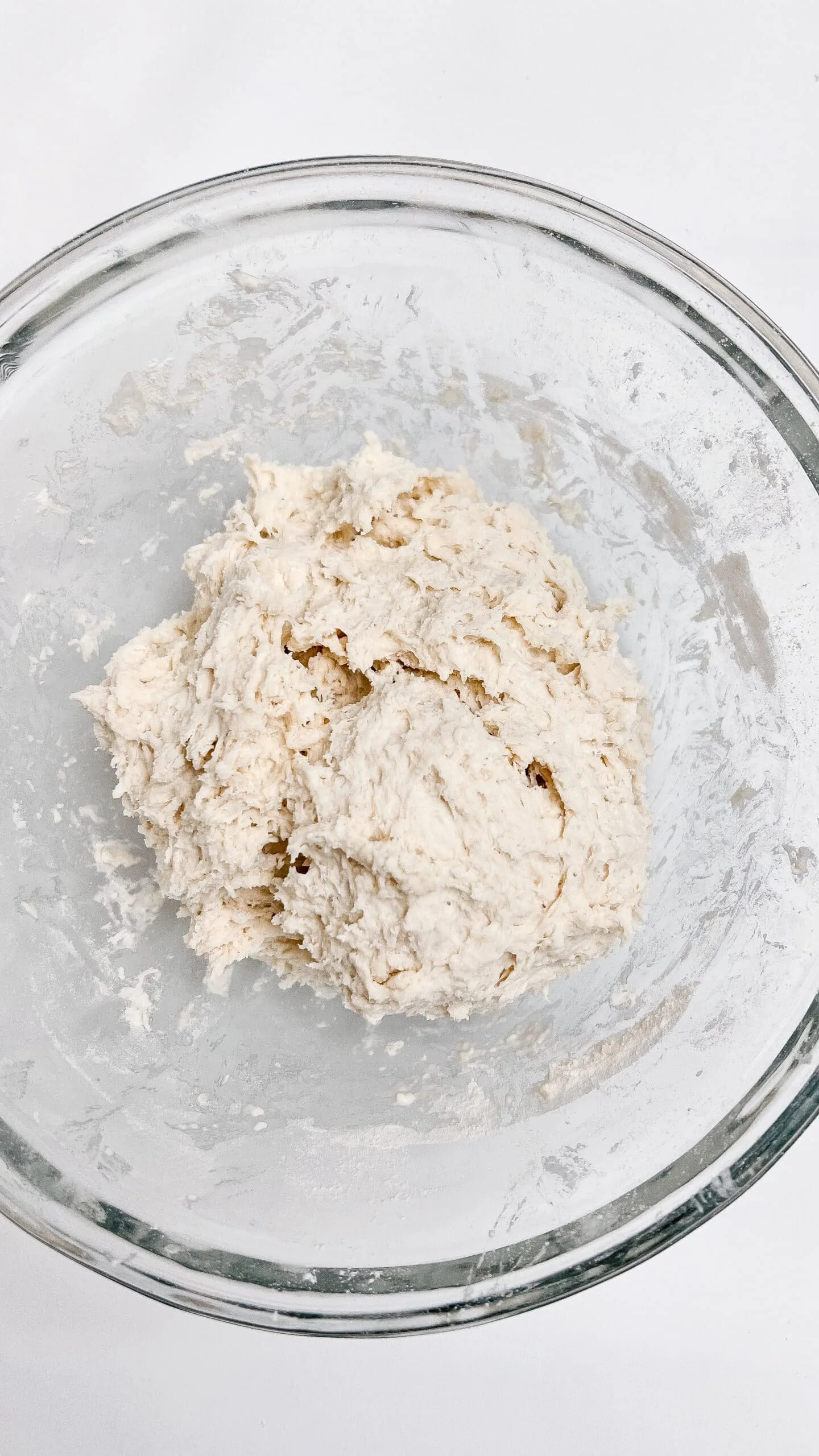 Sourdough dough for Easter swirl bread in glass bowl.