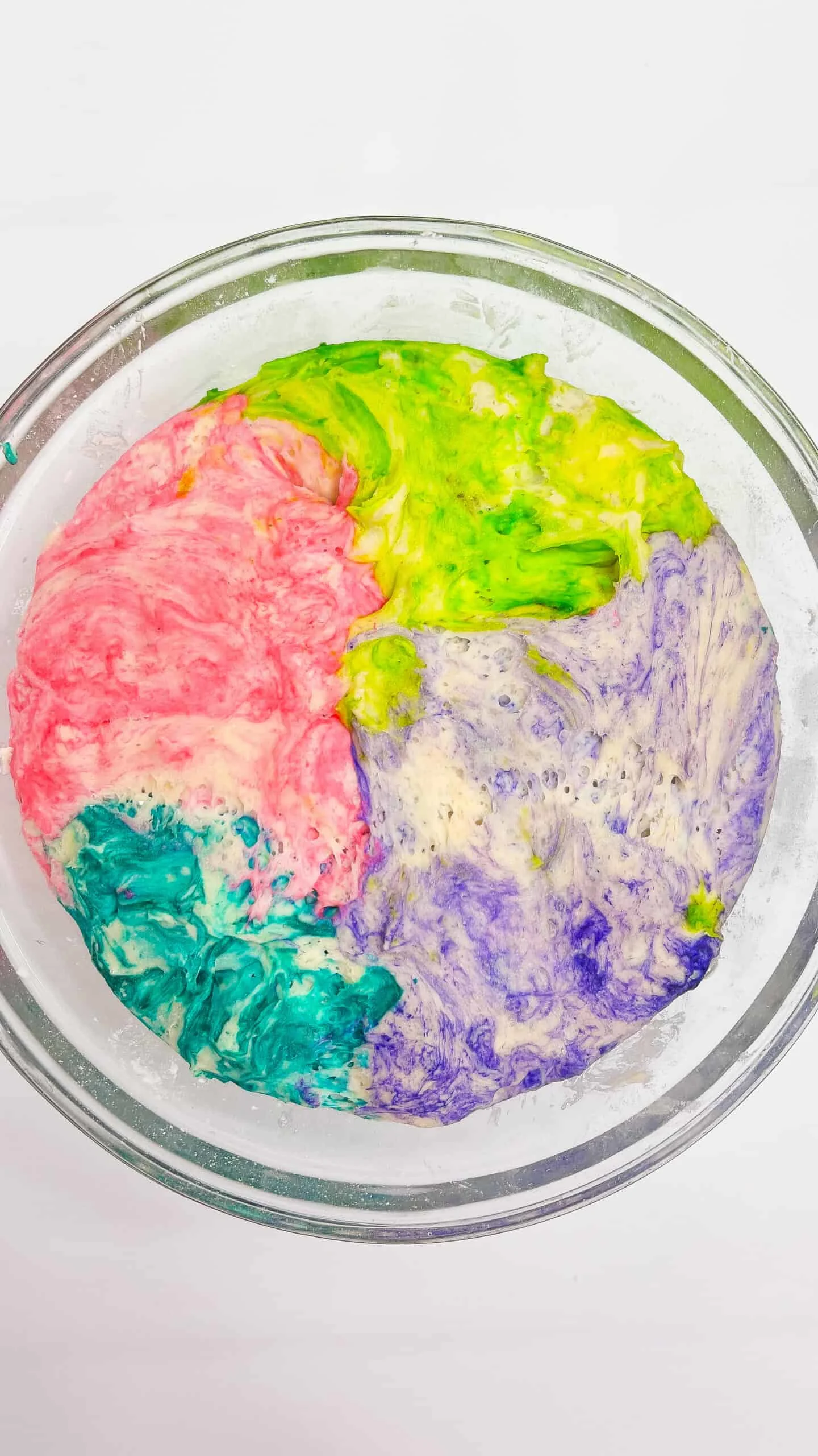 Colorful sourdough dough for Easter bread with vibrant swirls.