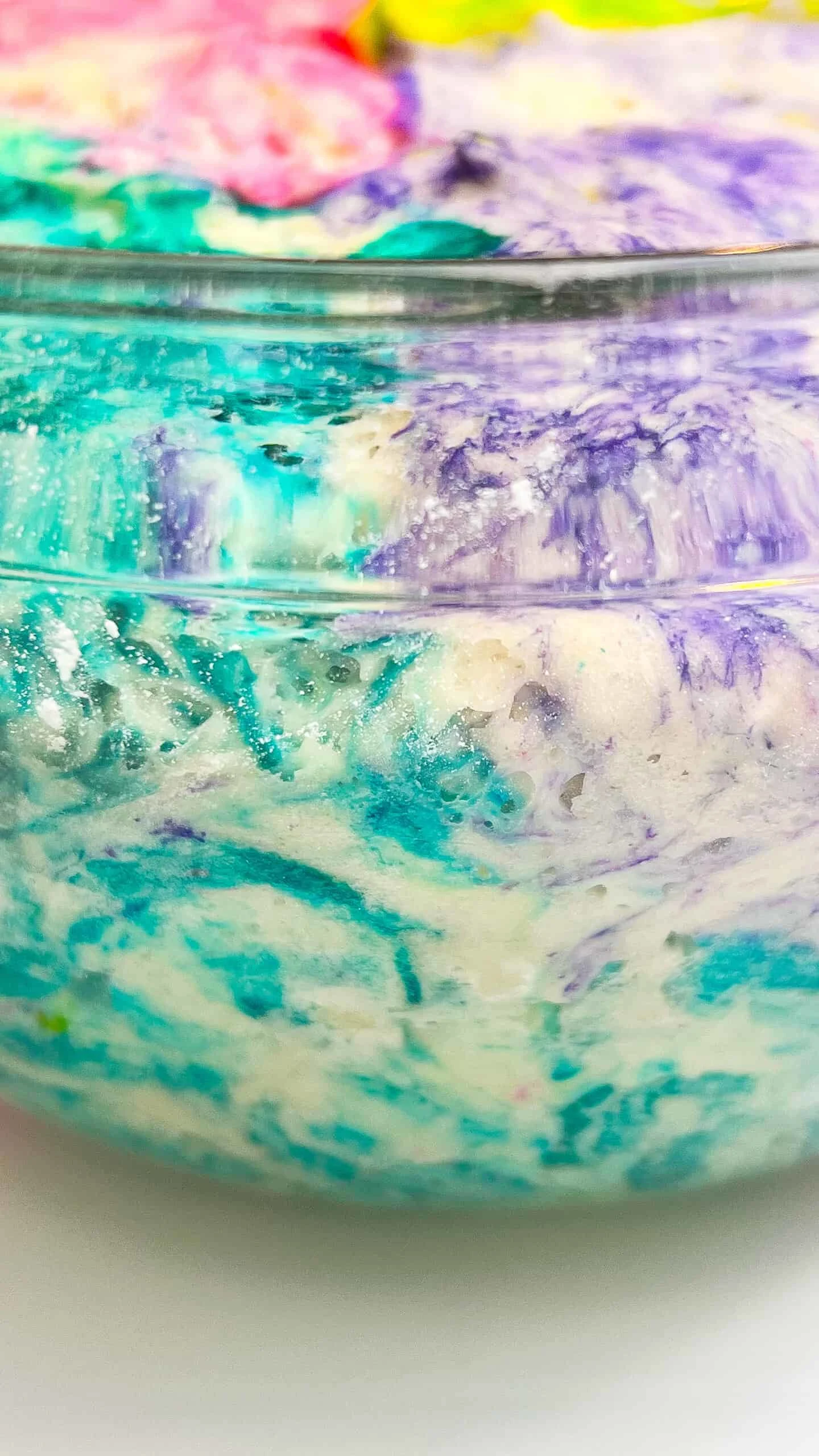 Colorful Easter sourdough swirl loaf with vibrant marbled pattern.