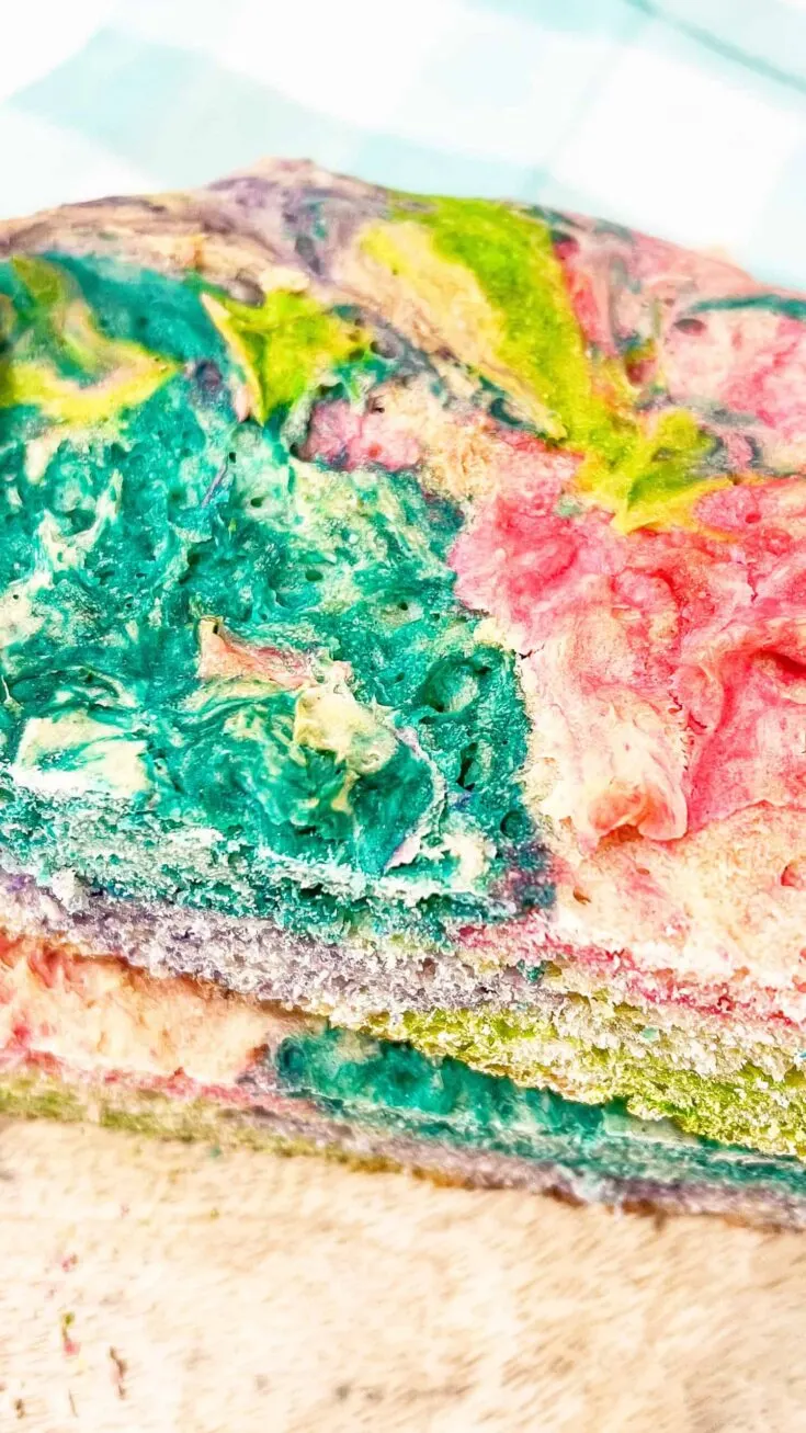Colorful Easter sourdough swirl bread with vibrant pink, green, and blue hues.