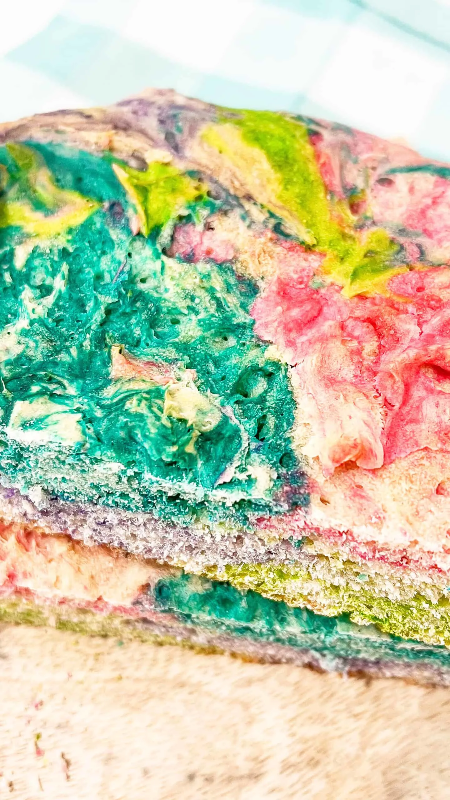 Colorful Easter sourdough swirl bread with vibrant pink, green, and blue hues.
