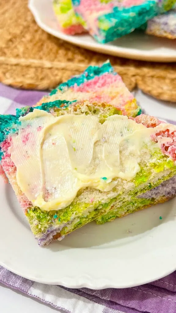Colorful Easter rainbow bread with vibrant layers and butter. Perfect for celebrating spring.