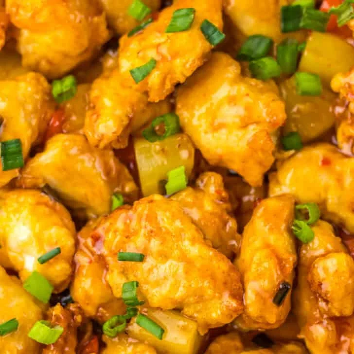 Sweet Chili Chicken with vibrant vegetables and crispy coating. Perfect for quick, flavorful meals.