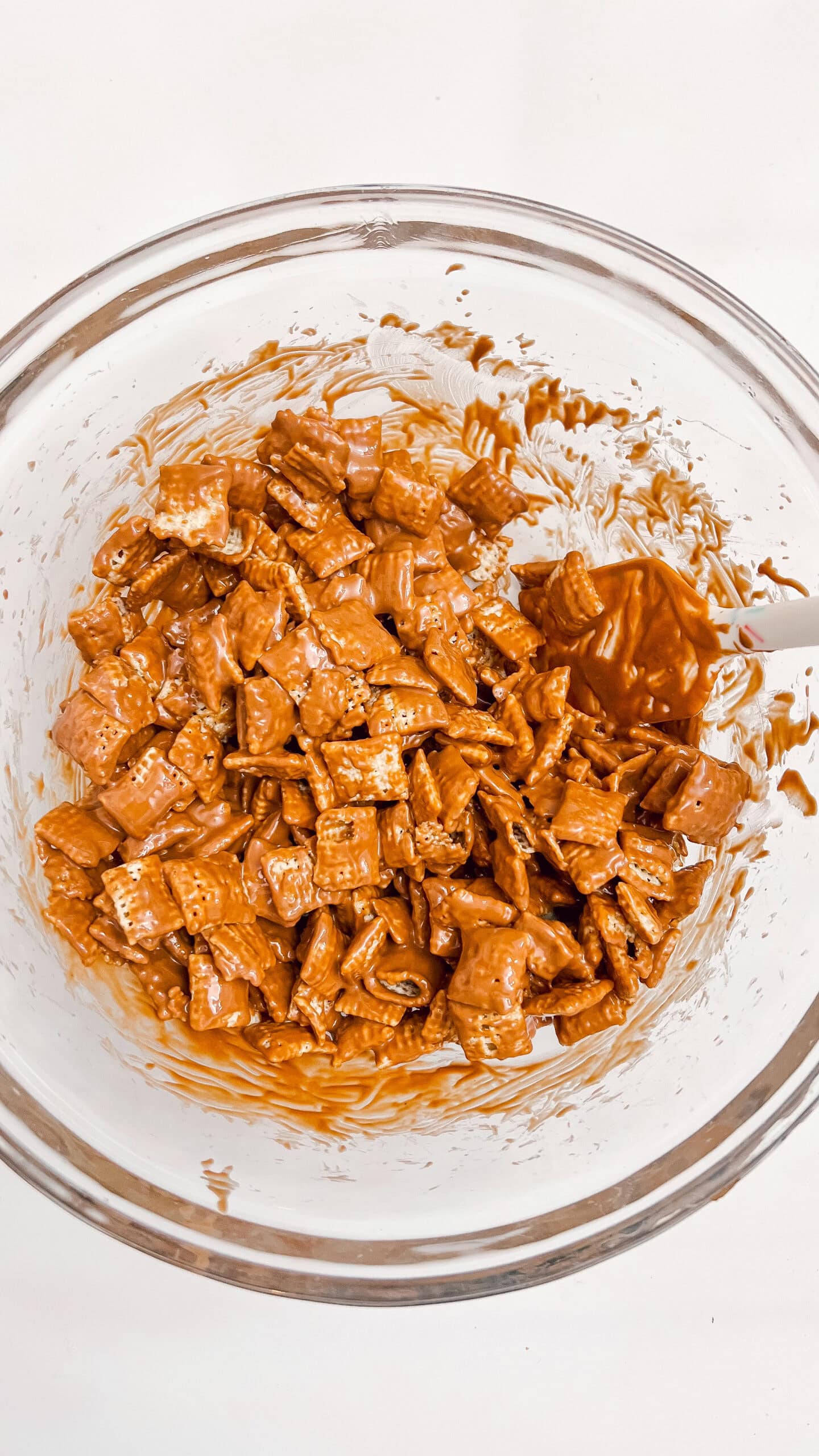 Muddy Buddy Cheesecake topping with chocolate and peanut butter flavor.