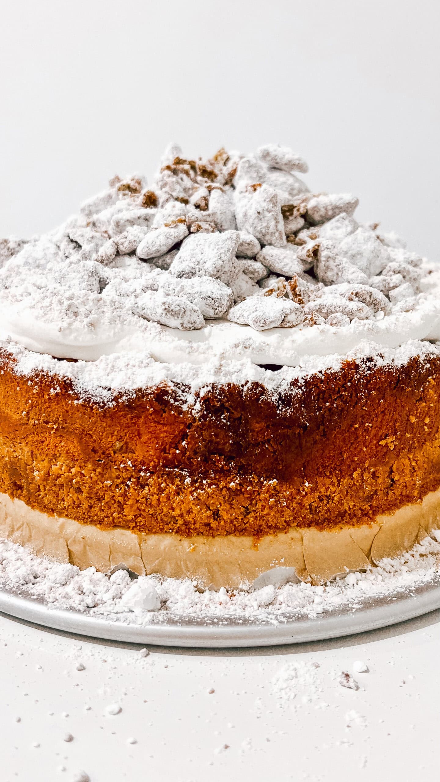 Delicious Muddy Buddy Cheesecake with powdered sugar topping.